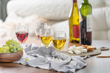 Wine glasses on table top. Luxury home background.