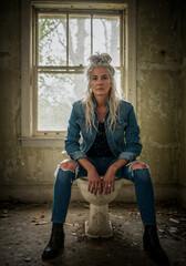 woman on toilet bowl in an old ruin