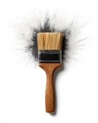 Paintbrush with dark gray paint splatter on white background.