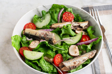garden salad  top with  mushrooms and sardines