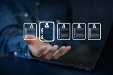 Business man  seek data to find a human data which are floating on screen