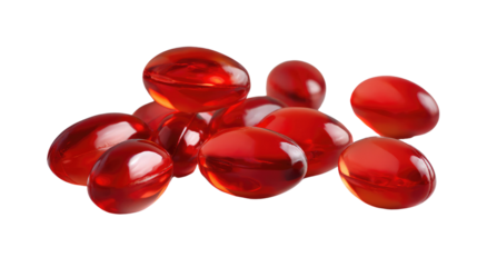 Red Pill Capsule : A group of oval translucent red pills or capsules on a surface, suggestive of medicine.