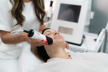 A woman enjoys a rejuvenating rf-lifting session
