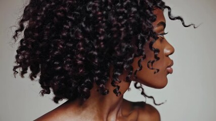 Graceful transformation: woman’s expressive hair and facial movements captured in a dynamic sequence