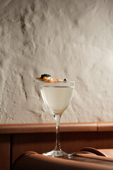 Modern Cocktail with Unique Garnish on a Bar Counter
