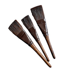 Three dark-handled paintbrushes with natural bristles, varying in size, arranged on a black background