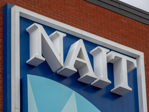 Edmonton, Alberta, Canada. May 20, 2025. Bold and modern, the NAIT sign stands prominently against a red brick wall, symbolizing innovation and technical education in Canada.