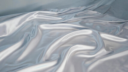 Elegant shimmering light blue satin fabric with soft folds and flowing waves, perfect for backgrounds and textures.