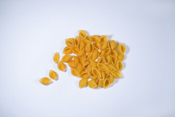 Conchiglie pasta on a white packground