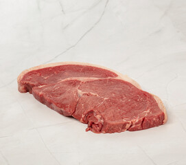 Fresh raw picanha steaks on marble surface ready for cooking preparation &ndash; High Resolution Raw Meat Image for Food Industry or Food Packaging