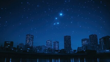 Fototapeta premium City skyline under a starlit night sky
