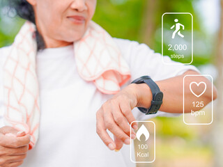 Asian Senior woman
checking step, calories burn, heart rate of exercise data tracking on smartwatch...