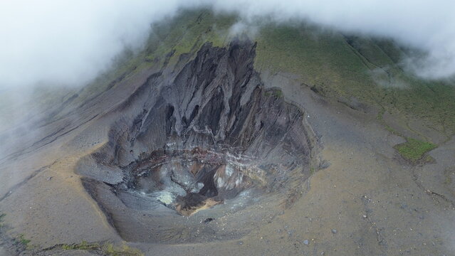 Panoramic view and natural landscape of the active crater of Lokon volcano, one of the twin volcanoes located in the Tondano plain near Tomohon, Sulawesi, Indonesia