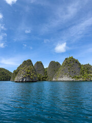 Naklejka premium Remote lagoon at Wayag island consisting of limestone islands, Raja Ampat, West Papua, Indonesia