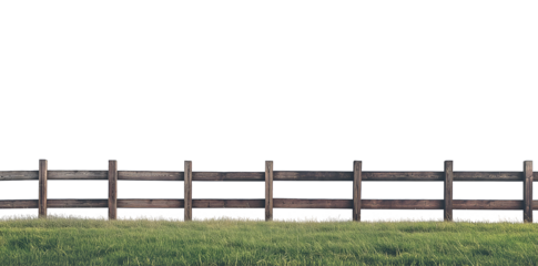 Wooden picket fence with green grass