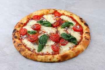 A Delicious Margherita Pizza topped with Cherry Tomatoes and Fresh Basil for a delightful meal