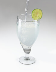 Homemade cocktail or clod drink with lime and mint isolated on white background 