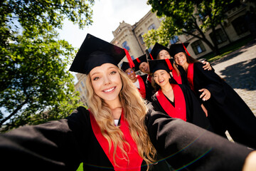 Photo of company groupmates students take selfie hug mortarboard gown graduate college building...