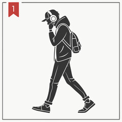 Young man walking headphones backpack urban style silhouette