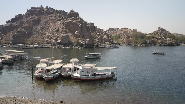 View of boats on the River Nile from Philae Temple on a sunny day, Philae Temple, Aswan, Egypt, Africa
