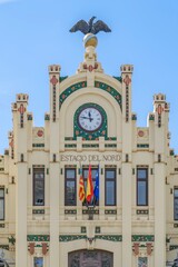 Estacio Del Nord Main Facade With grand Clock And Eagle sculpture, Historic Valencia Train Station, Estacion del Norte, North Station