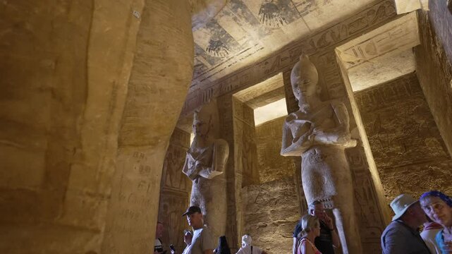 View of tourists in the interior of the Great Temple Of Ramesses Il at Abu Simbel, Abu Simbel, Egypt, North Africa, Africa