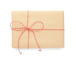 Gift wrapped in kraft paper with bow isolated on white, top view