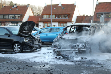 a car completely burned out and extinguished by the fire brigade