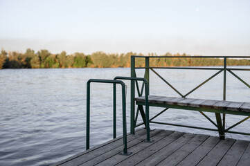 Pier with wooden decking and metal railings