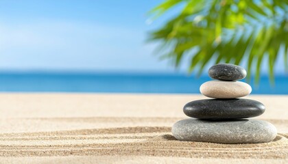 Obraz premium Serene Balanced Stone Composition on Tranquil Beach Background
