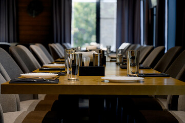 Table setting. Close-up photo of empty glasses, plates and spoons