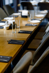 Table setting. Close-up photo of empty glasses, plates and spoons