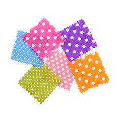 Samples of fabrics with polka dot pattern isolated on white, top view