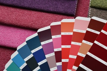 Samples of colorful fabrics and color palettes, above view