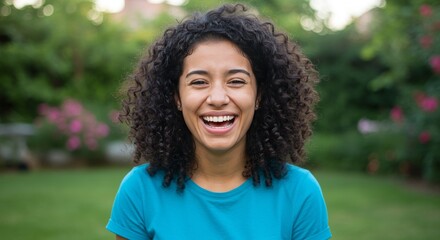 happy women laughing isolated on green ,young girl wearing t shirt laughing out loud ,having fun with funny jokes ,isolated interior photo in beuatiful and luxurious yard