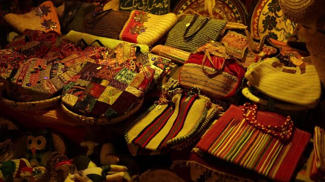 Handcrafted bags market vibrant mix of woven textures patchwork patterns and colorful fabrics each piece tells a story of tradition culture and artistry in this warm and soulful Eastern display