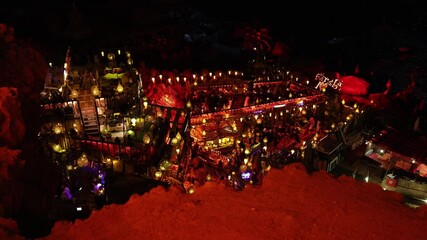 Cozy lantern-lit terrace nightlife Eastern vibes meet vibrant gatherings as people relax in colorful open-air lounges warm lights textures and laughter blend into a dreamy cultural evening escape