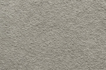 Obraz premium A close-up texture of a light gray plaster wall, showcasing intricate patterns and a rough surface. Ideal for background use in architectural or design projects.