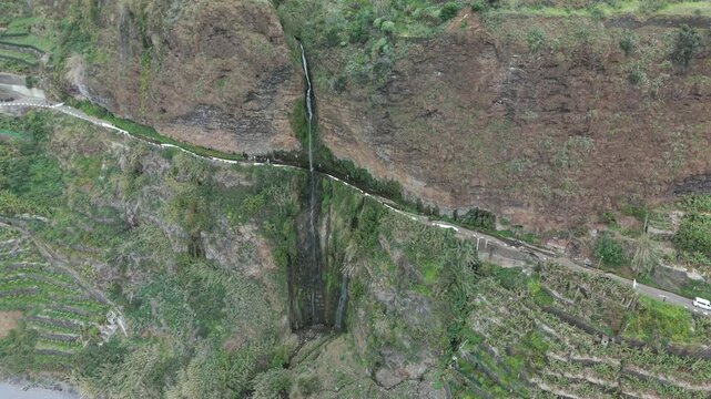 Madeira fly over at south atlantic coast with the Anjos Waterfall landscape