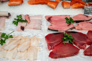 Different kinds of fish fillets for sale at a market in Barcelona, Spain