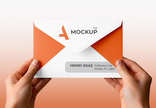 Hand Holding an Envelope Mockup