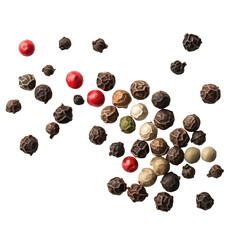 A top down view of a scattering of peppercorns in various colors on a plain black background surface on transparent background