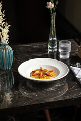 Portion of sweet corn porridge with strawberries breakfast