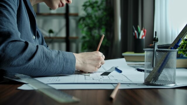Person Working on Architectural Designs