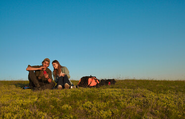 Two Friends Exploring the Outdoors with a Smartphone