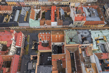 Drone aerial view of a historic city center featuring charming courtyards, cozy residential areas,...