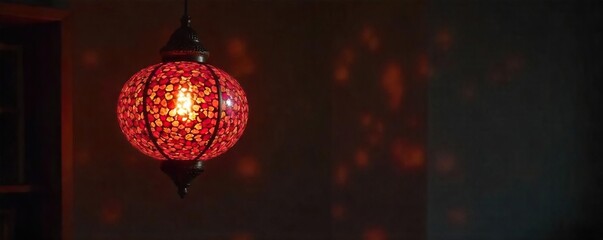 Fototapeta premium Intricate pomegranate-inspired pendant lamp illuminates a dark room, casting warm, jewel-toned light Perfect for autumnal, bohemian, or Mediterranean-themed interiors , glass, luxury