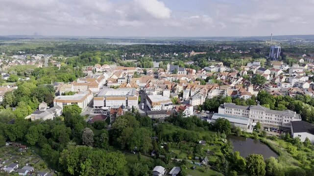 Aerial drone view over the historic old town of Borna, Saxony, Germany, with red-roofed houses, church, and surrounding green landscape&mdash;showing the charm of this district seat near Leipzig.