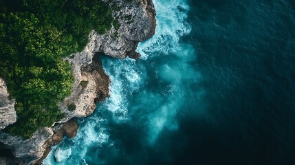 Coastal Cliffs: Ocean waves crash against a rocky shoreline from above.