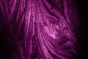 Closeup of purple fluid metallic acrylic paint textured background